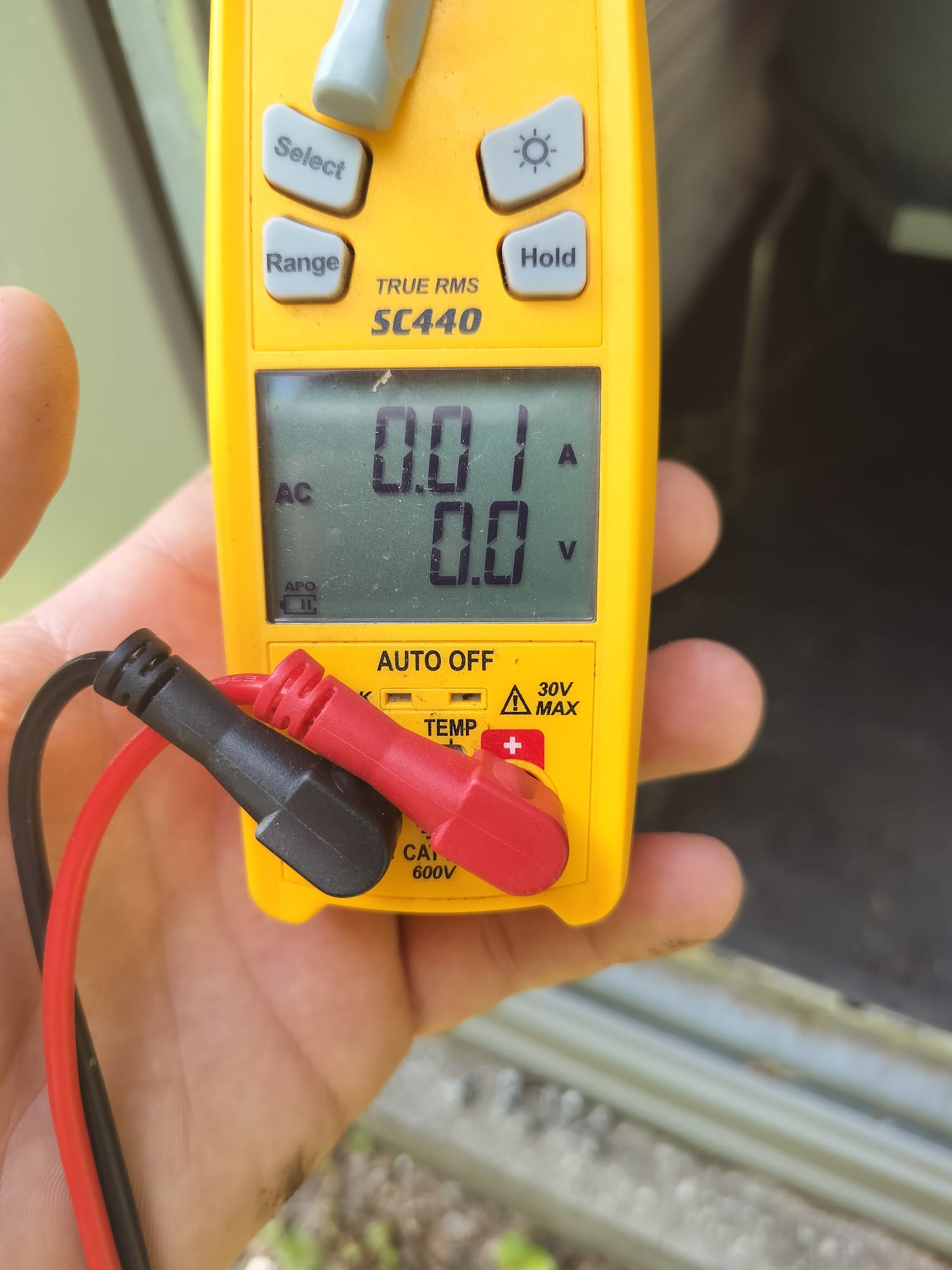HEP Technician Checking System Parameters with a Digital Multimeter