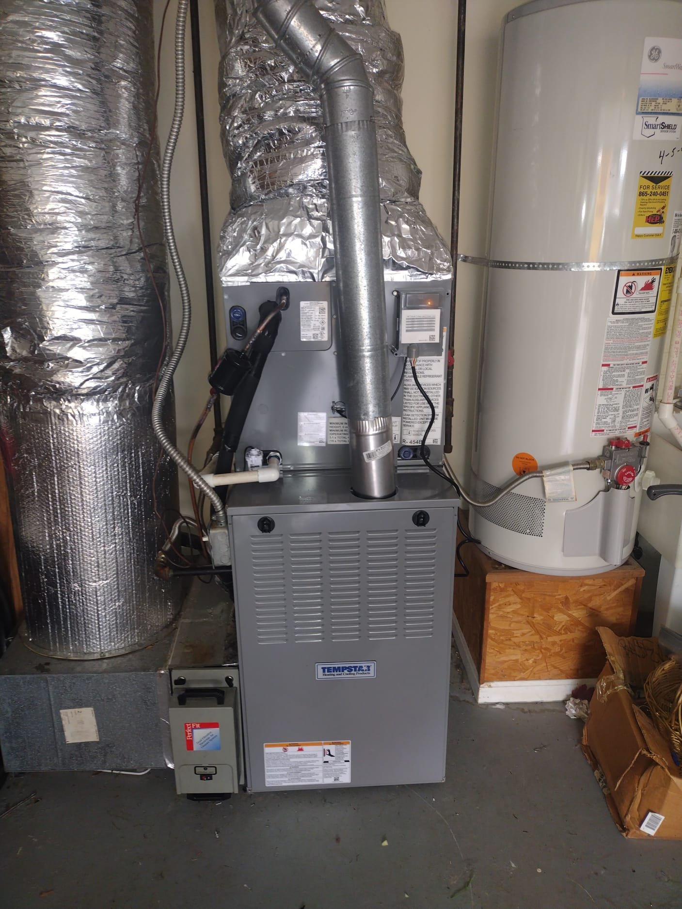 Newly installed HVAC system setup with organized components in a home