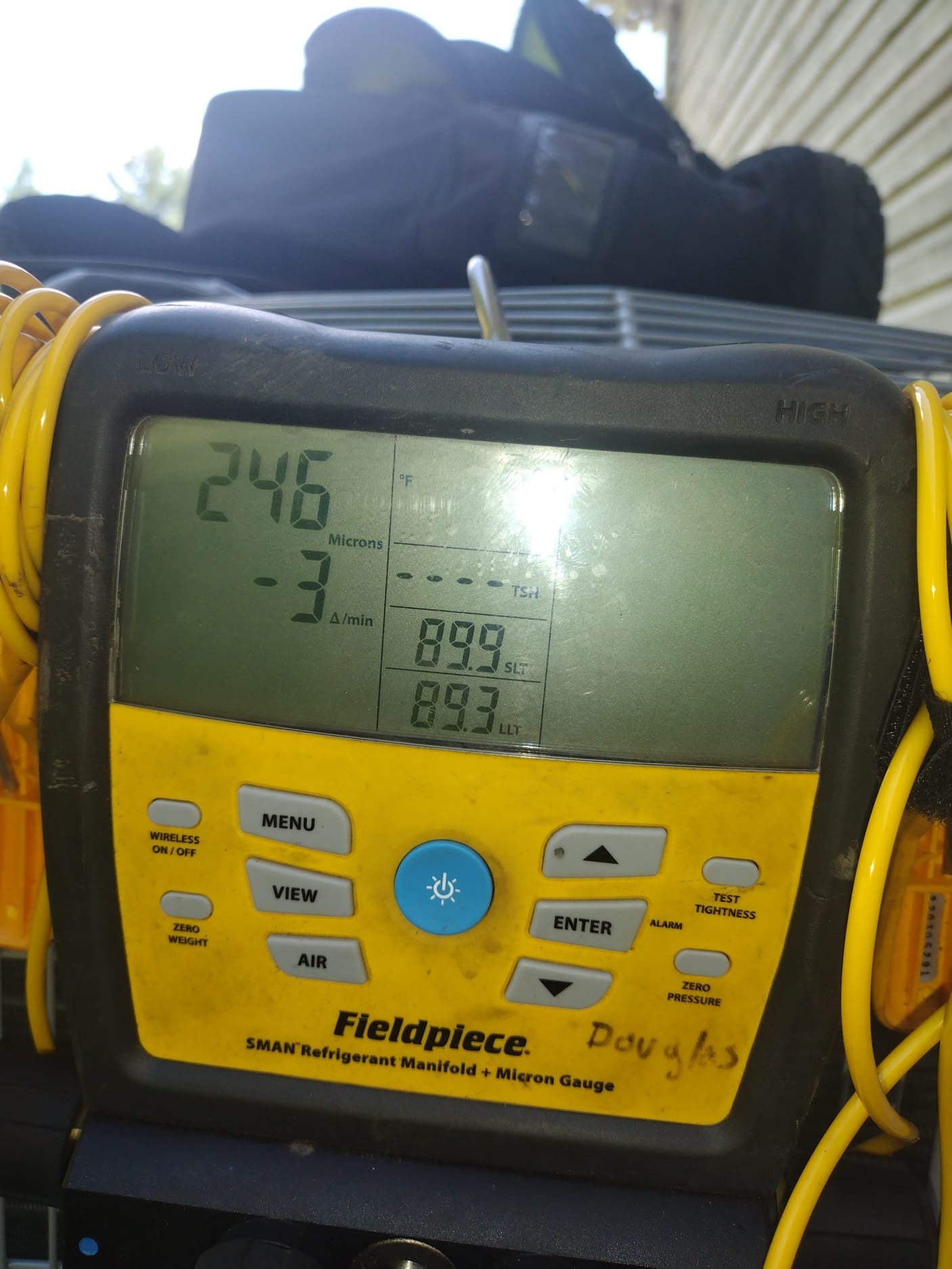 HEP technician using specialized equipment to verify performance during installation