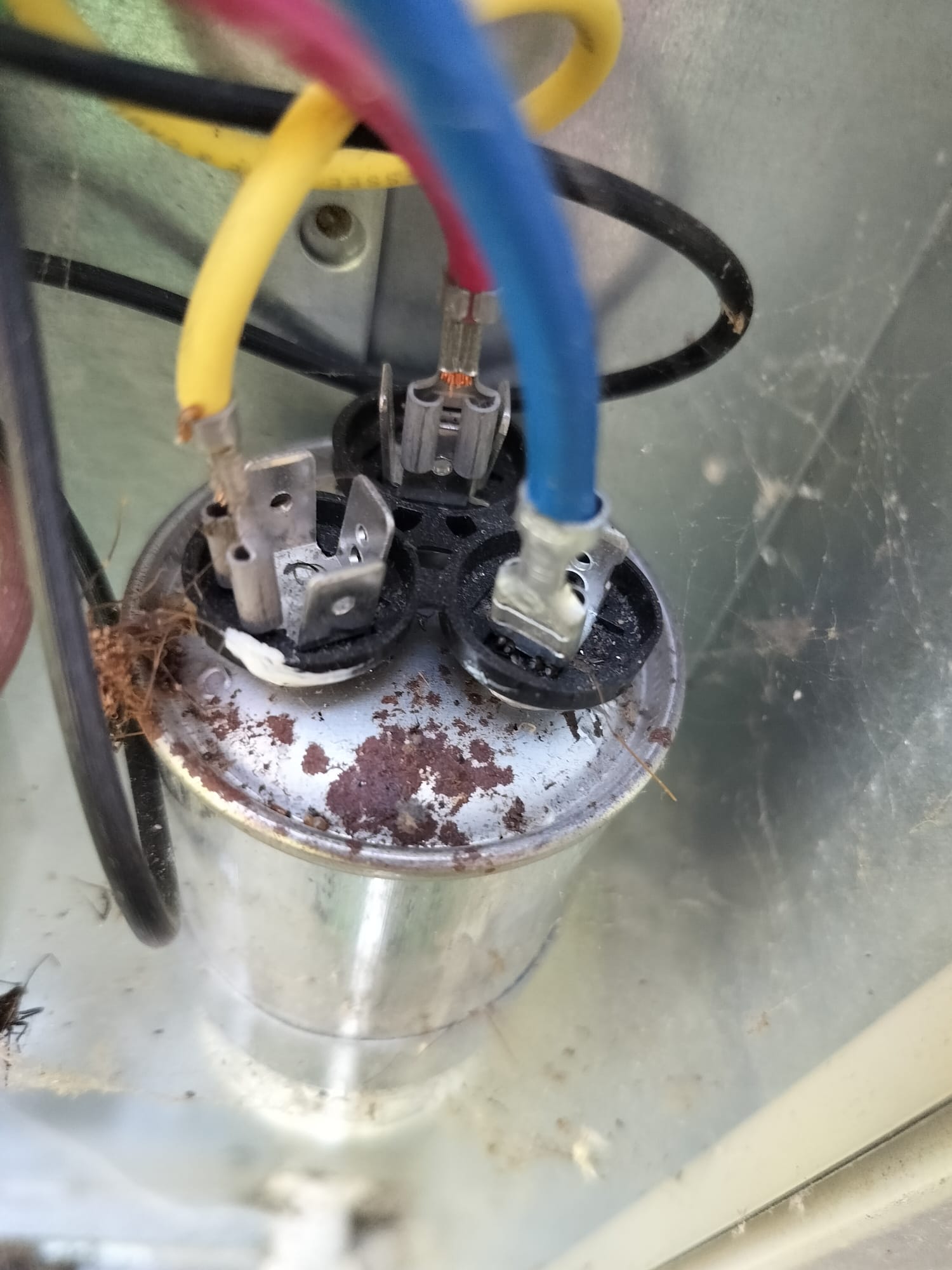 Old HVAC capacitor before maintenance