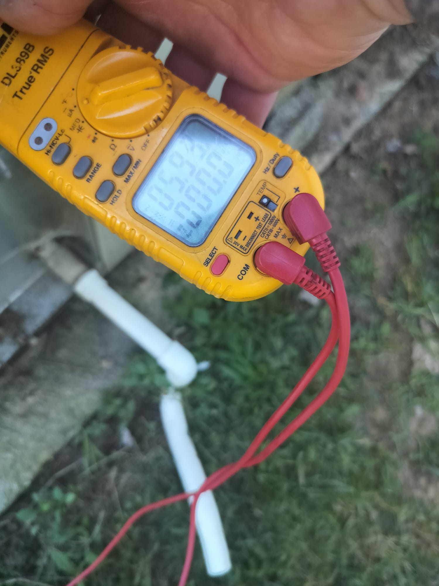 Digital multimeter being used during inspection