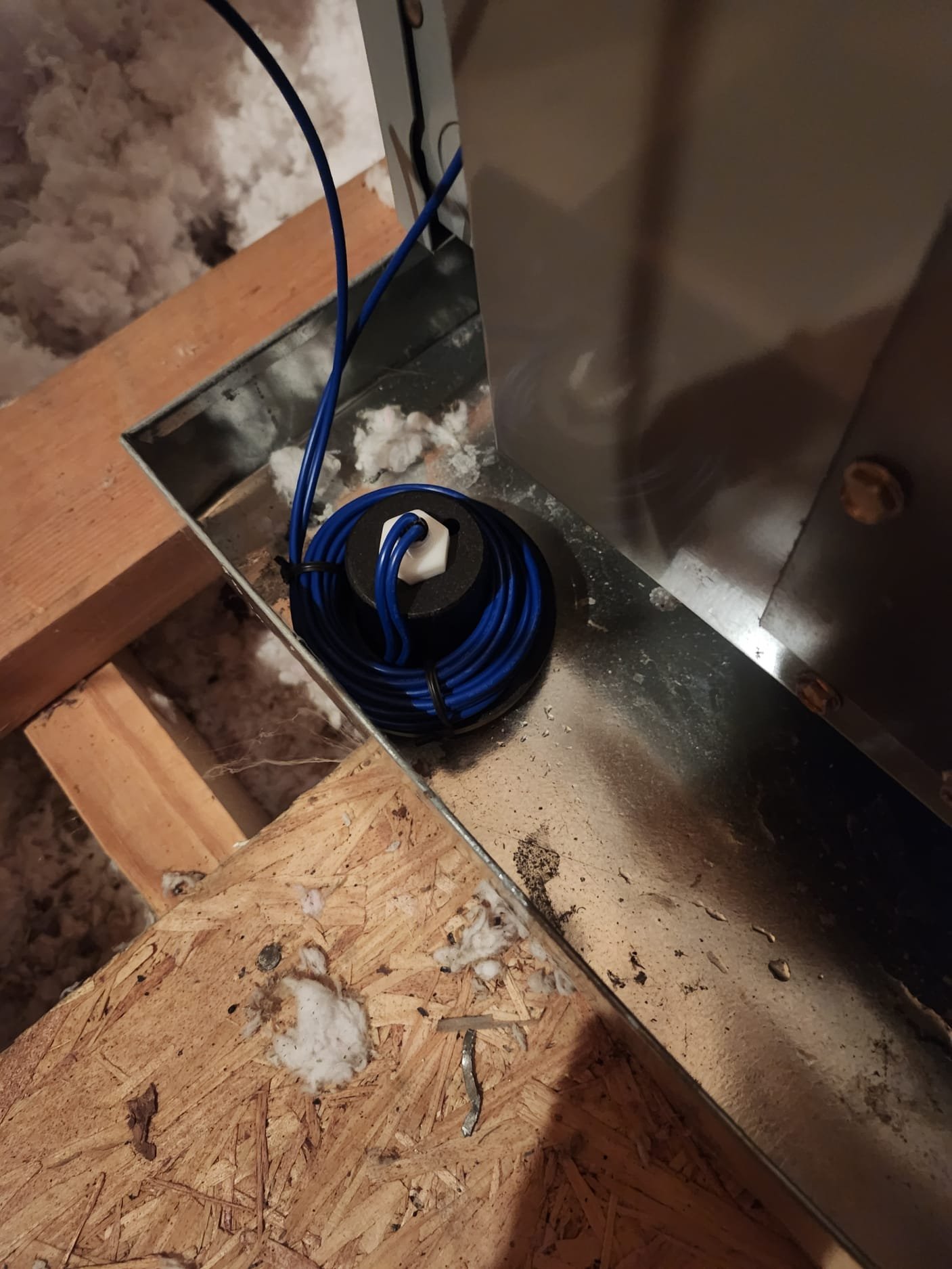 Neat wiring and sensor installation on an HVAC coil in an attic space