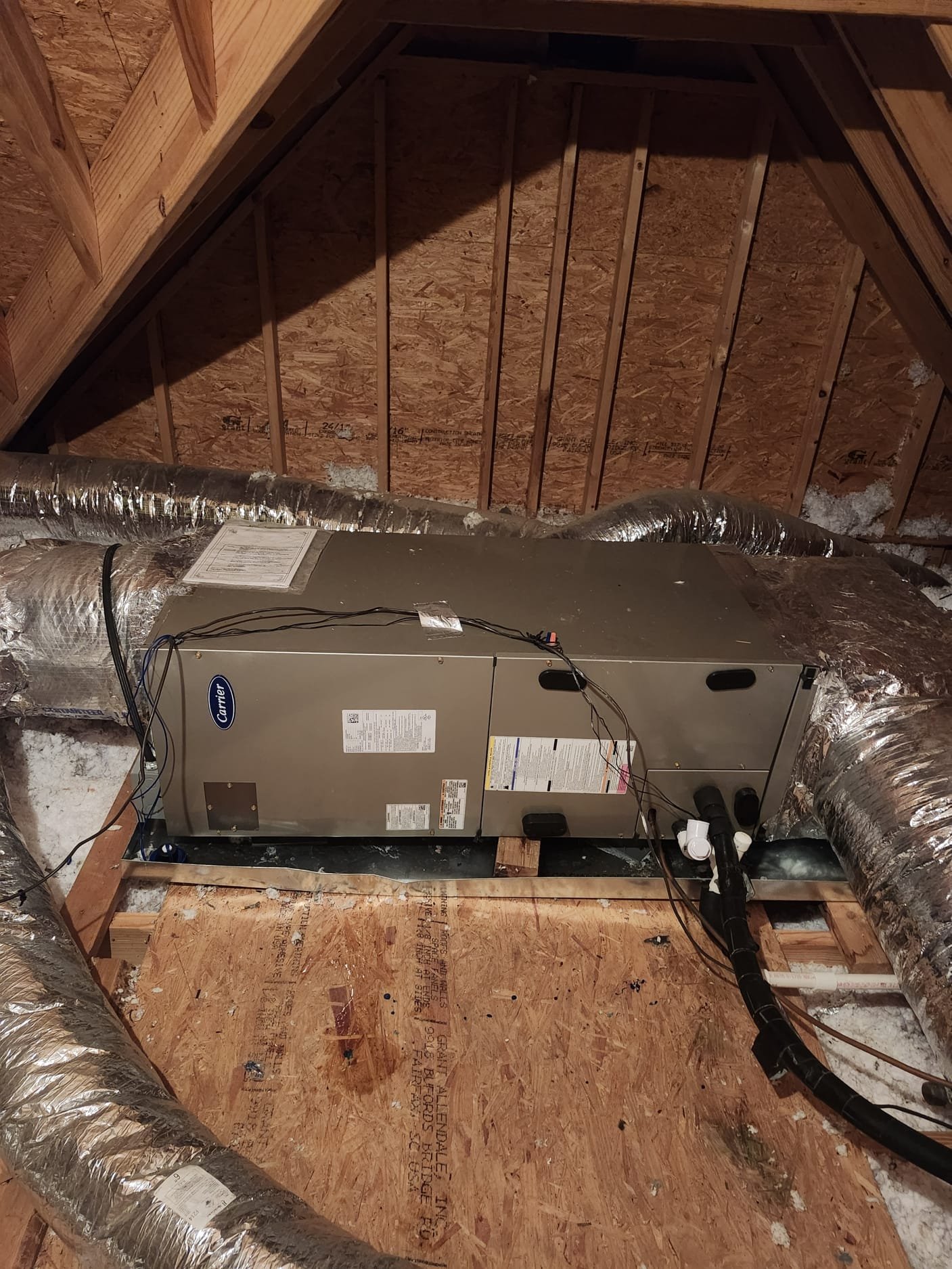 An air handler unit installed in a clean attic space