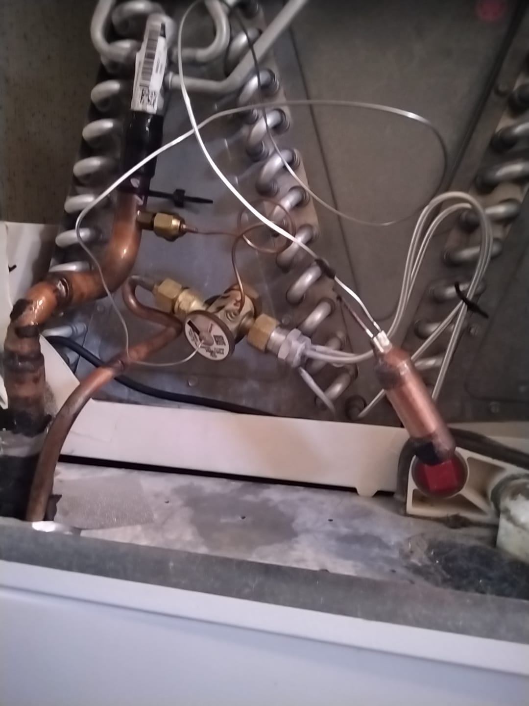 Inside view of the evaporator coil and condensate pan