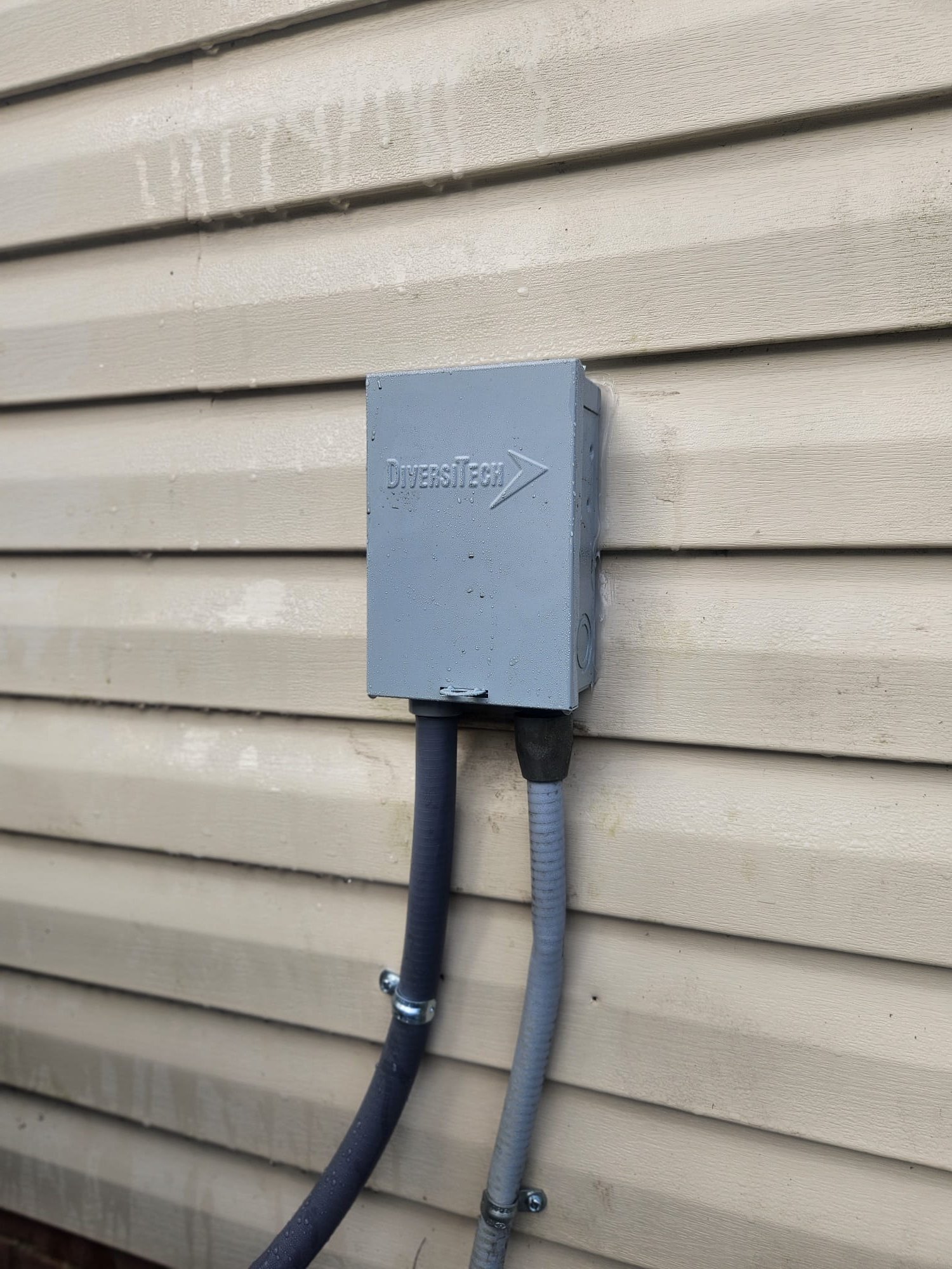 New disconnect box neatly mounted on home exterior