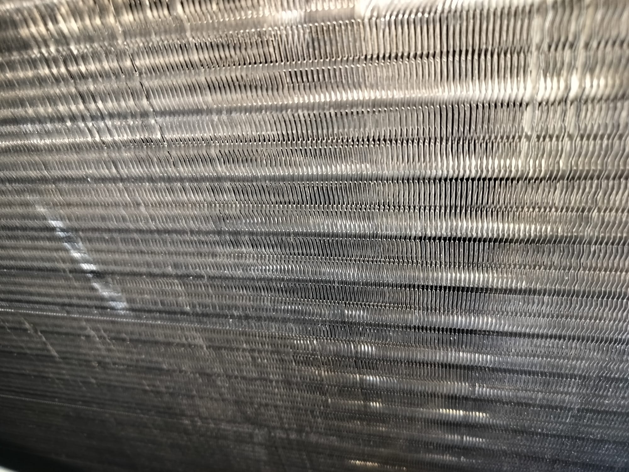 Close-up of clean HVAC coil fins after maintenance