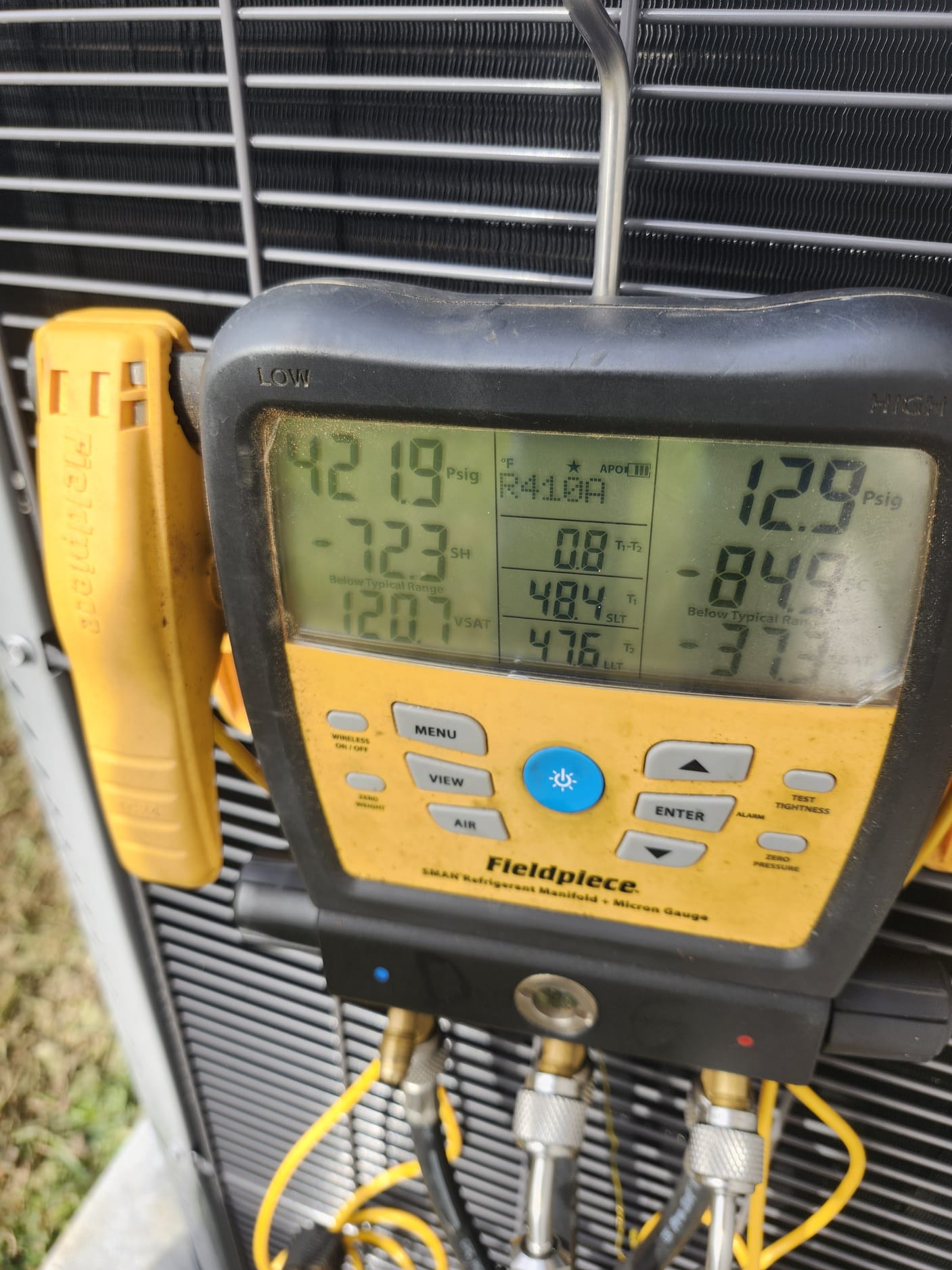 Refrigerant and performance check using a digital manifold gauge.