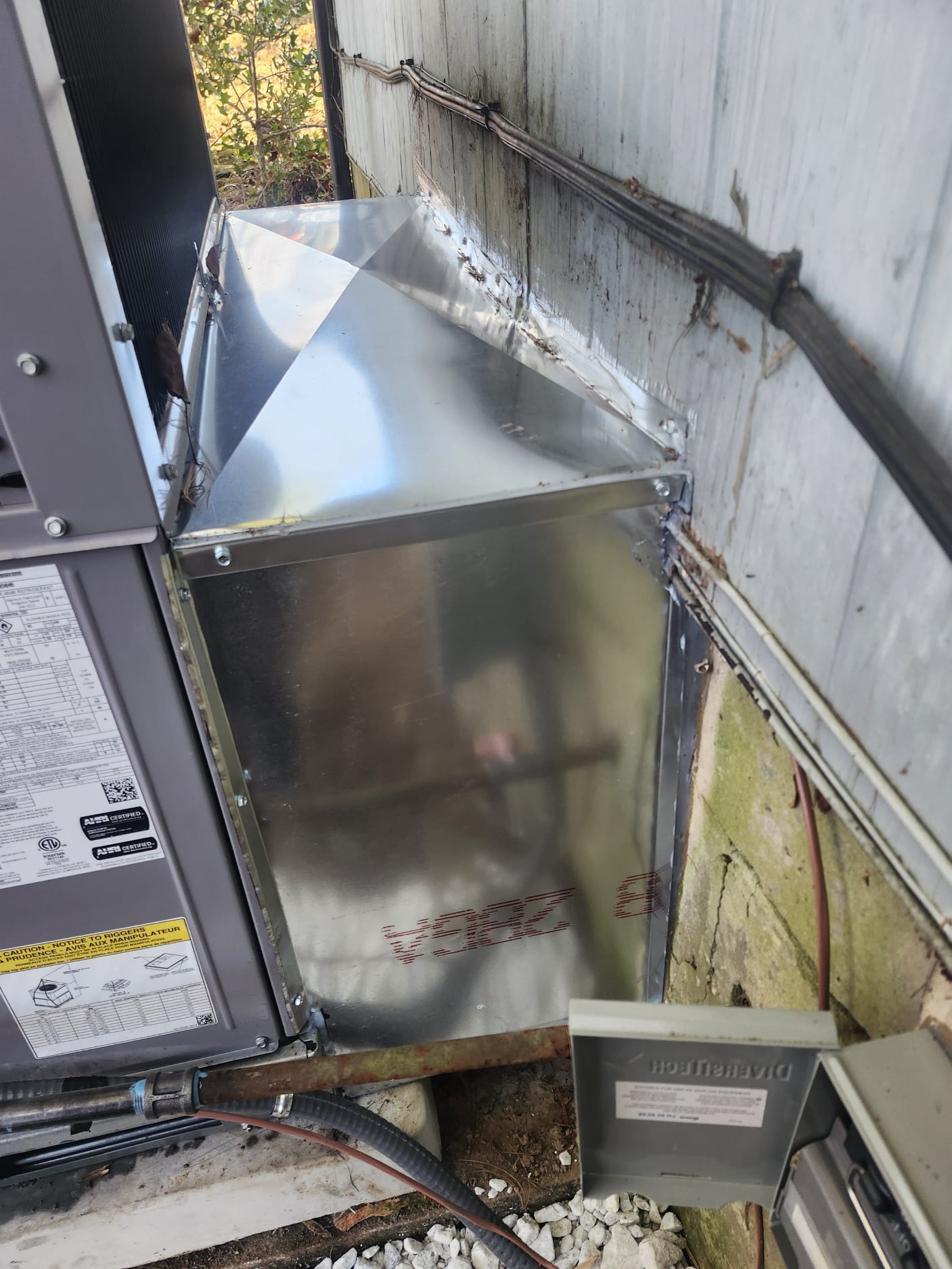 Sheet-metal duct transition professionally fitted and sealed by HEP technicians.