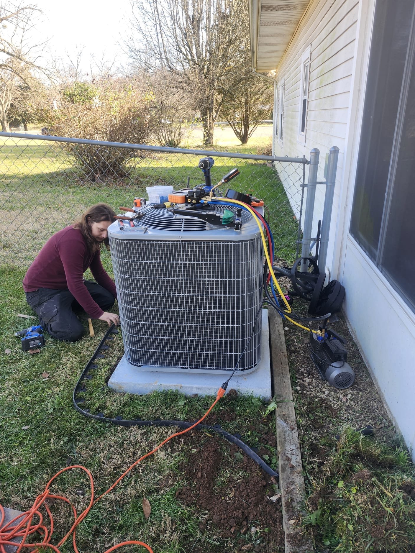 HEP Technician Connecting Gauges to Outdoor Unit