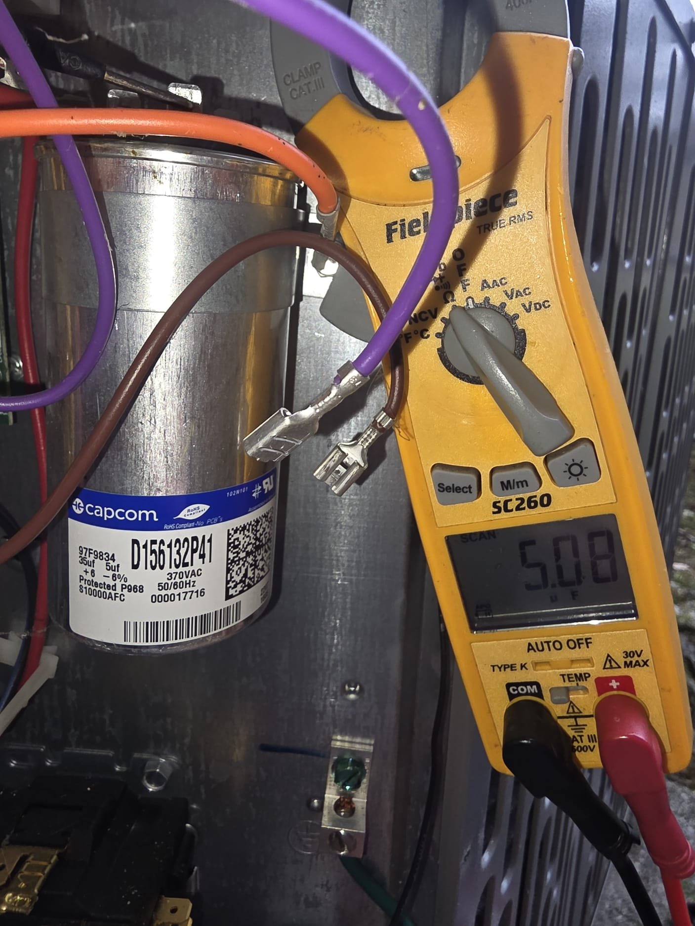 New capacitor and testing tool close-up