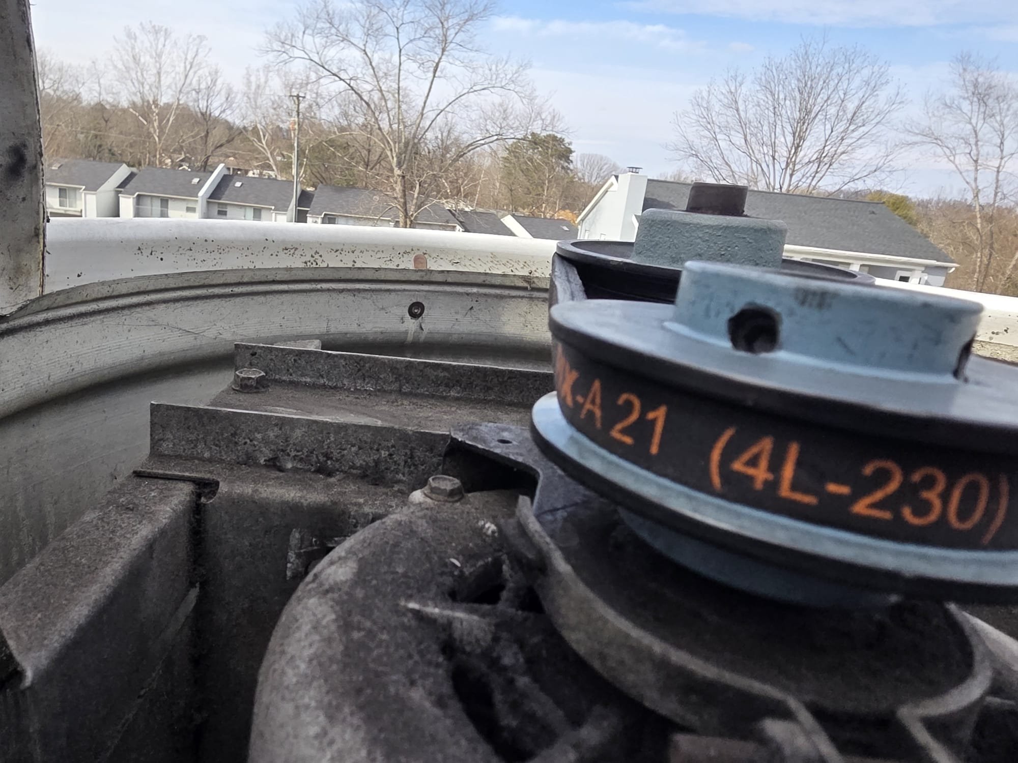 Close-up of a newly replaced drive belt and pulleys.