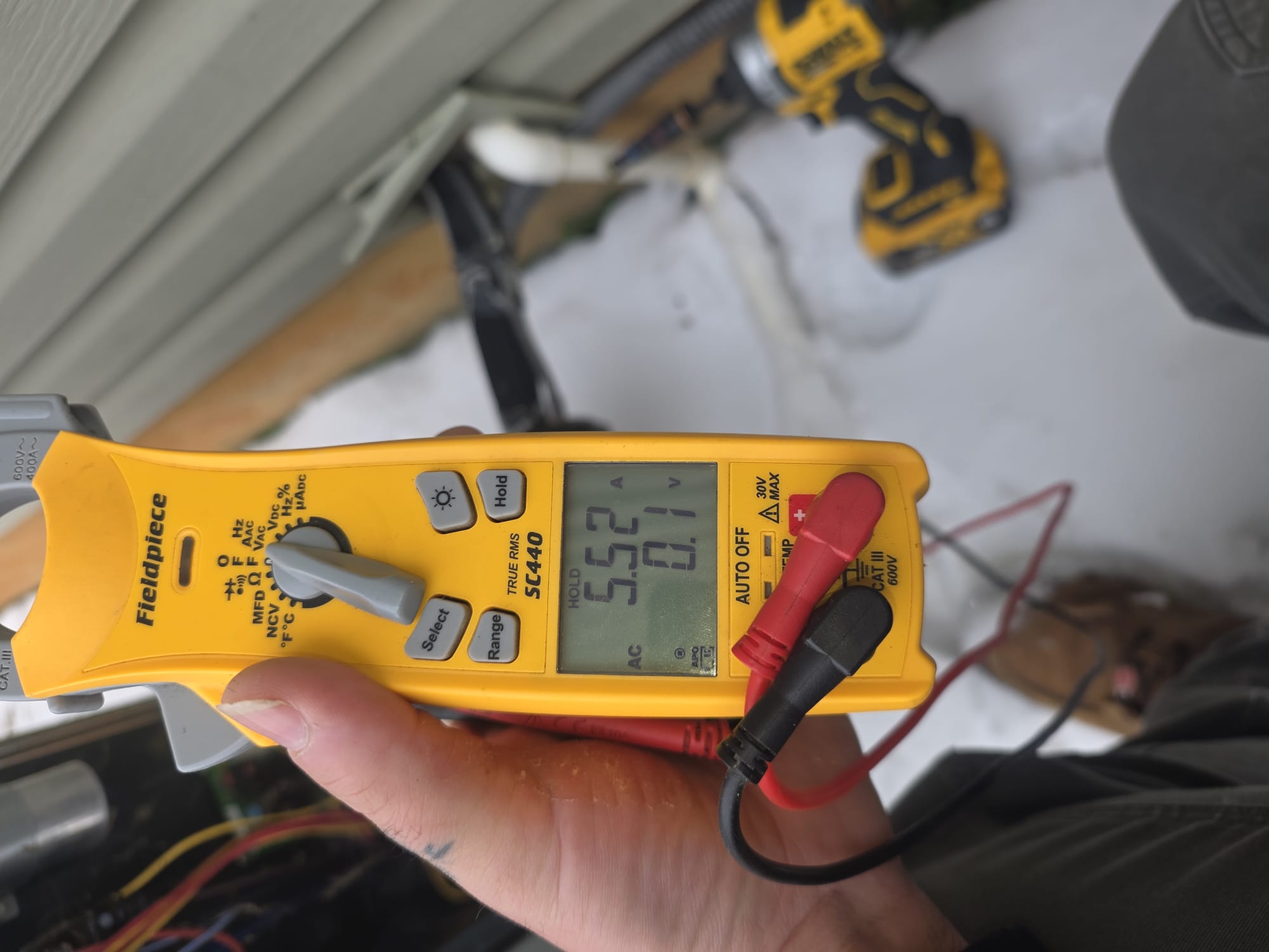 Technician Using a Clamp Meter for Diagnostics