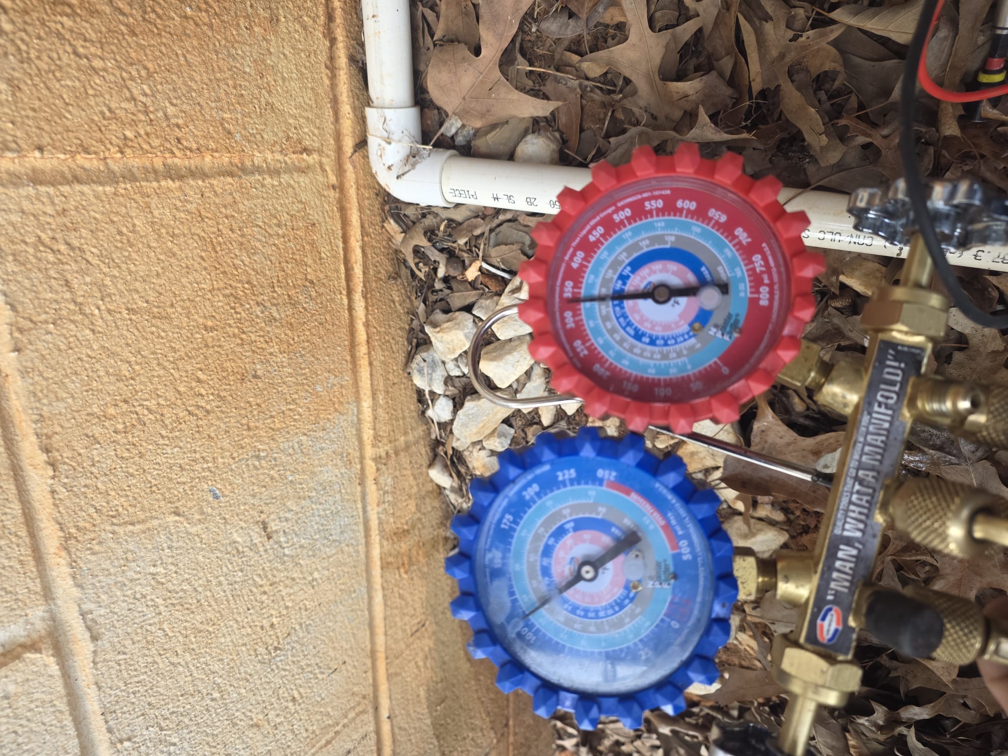 HEP Technician at Work with HVAC Manifold Gauges