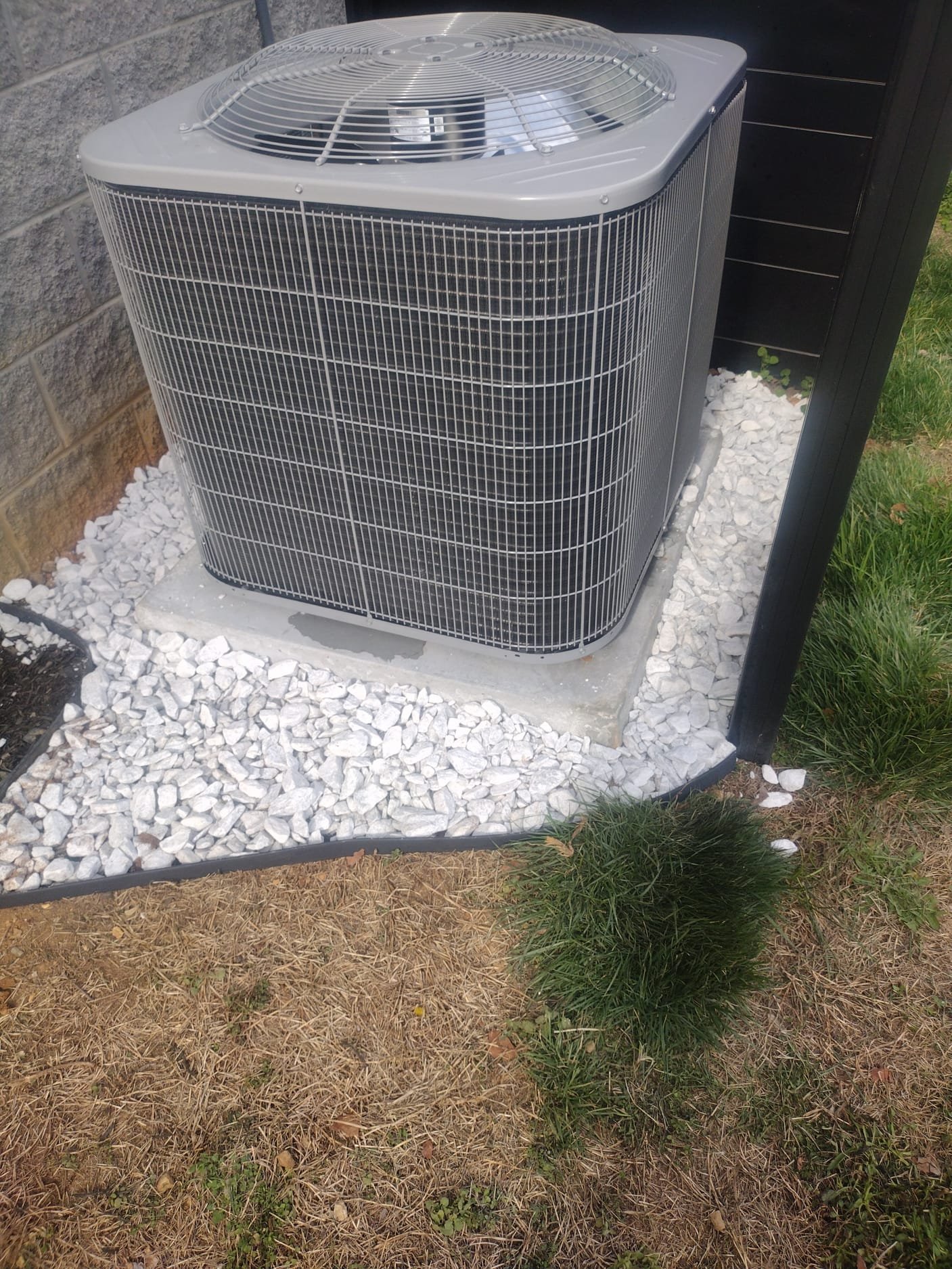 New outdoor condenser on gravel