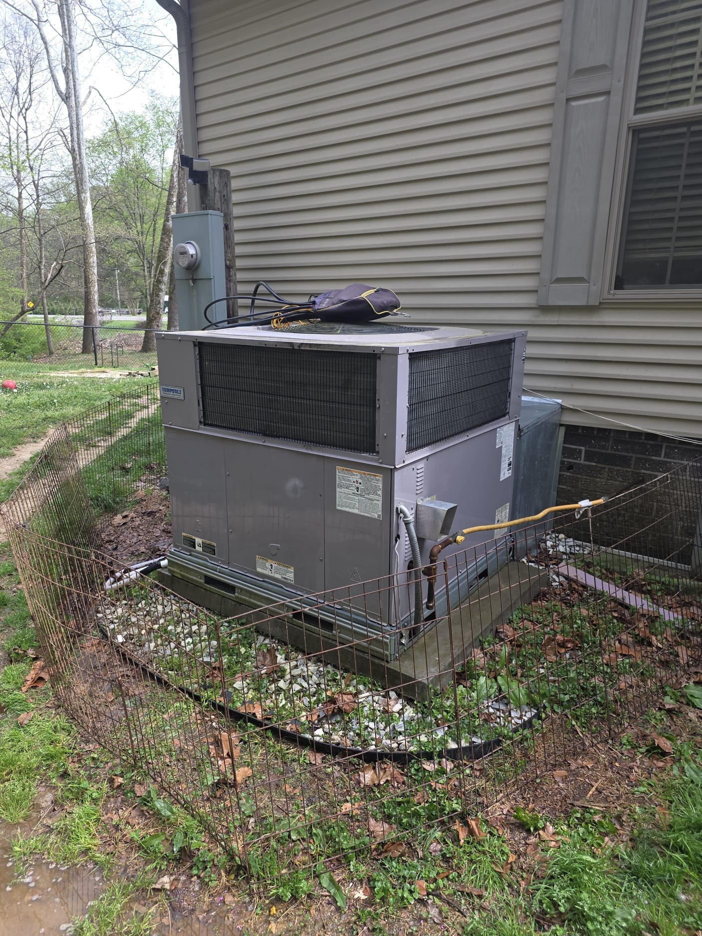 Outdoor HVAC Unit with Technician Tools