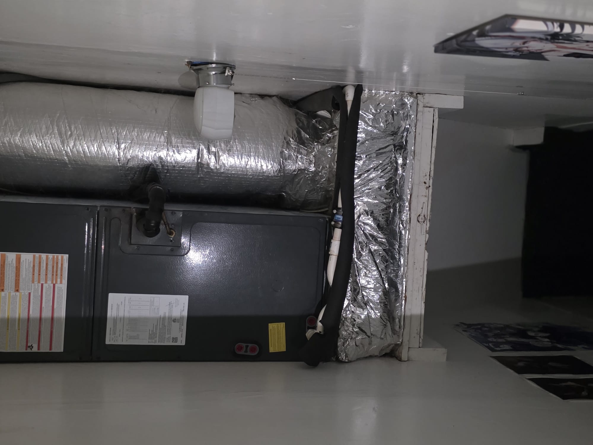 Well-maintained air handler unit installed above a platform