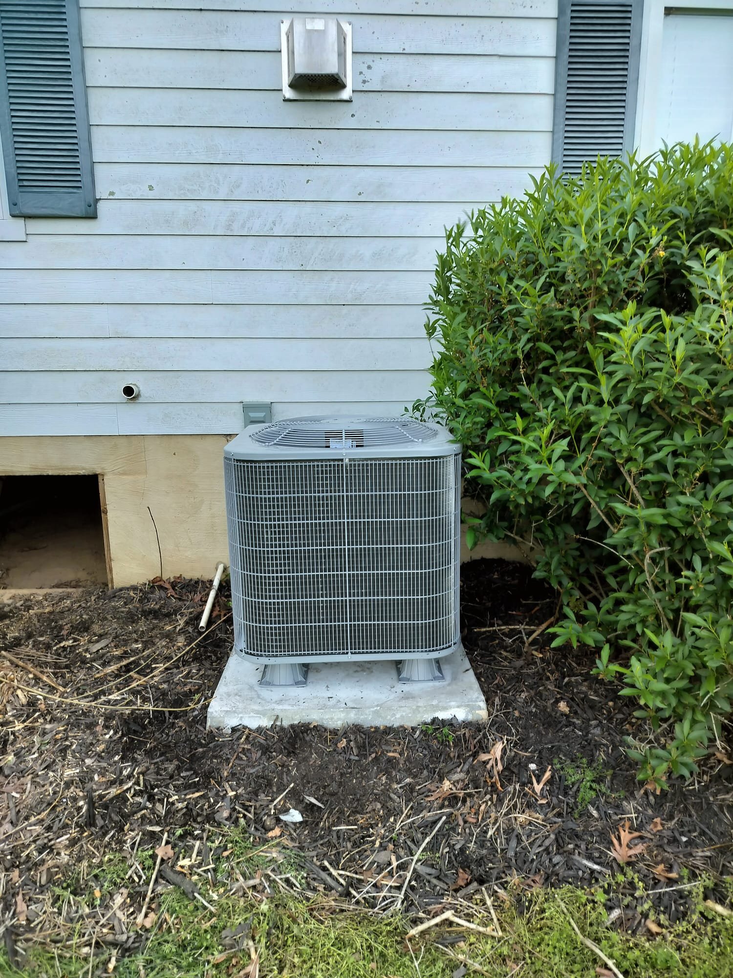 Newly installed outdoor HVAC condenser unit