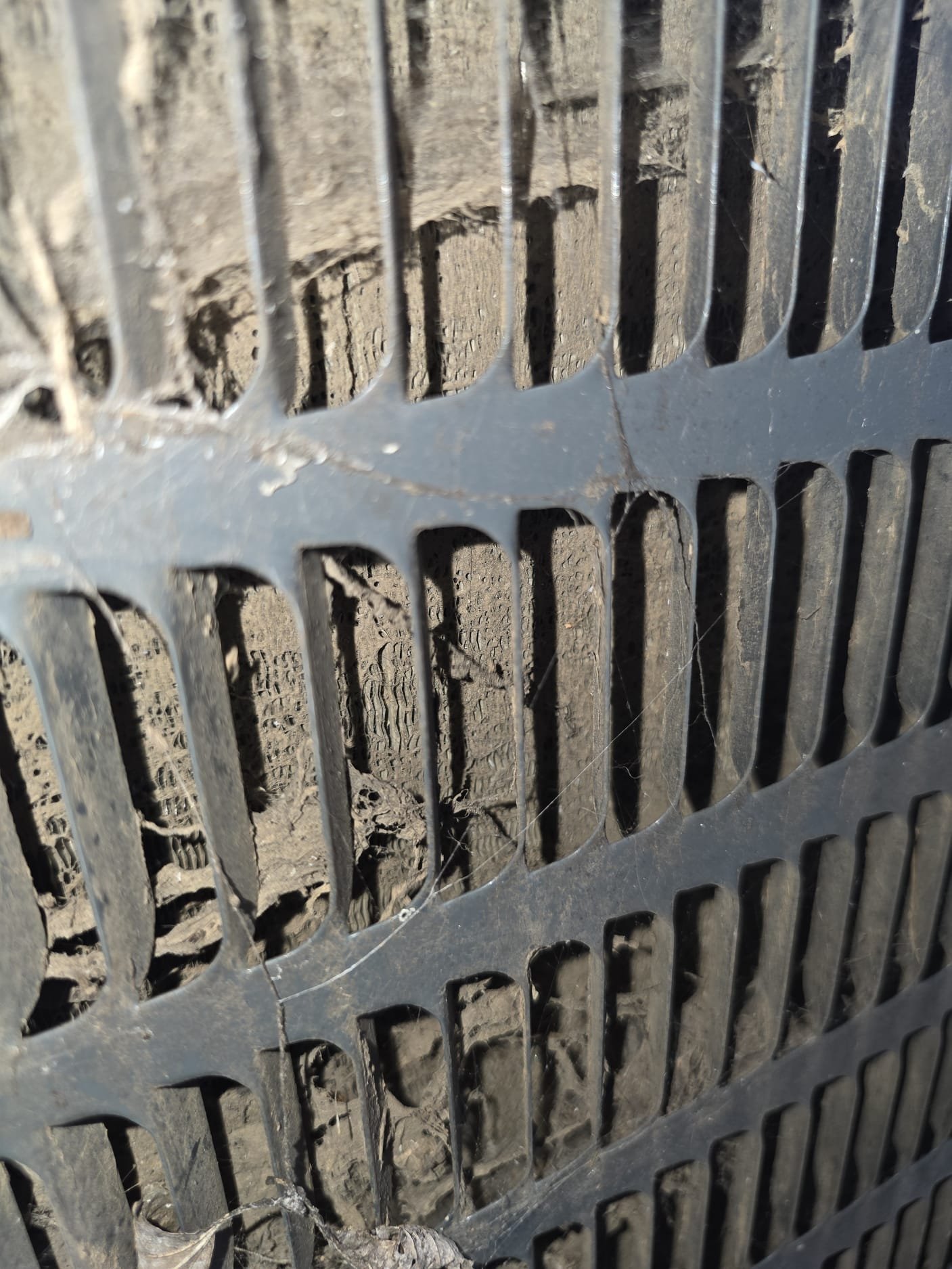 A dirty outdoor condenser coil that needs cleaning