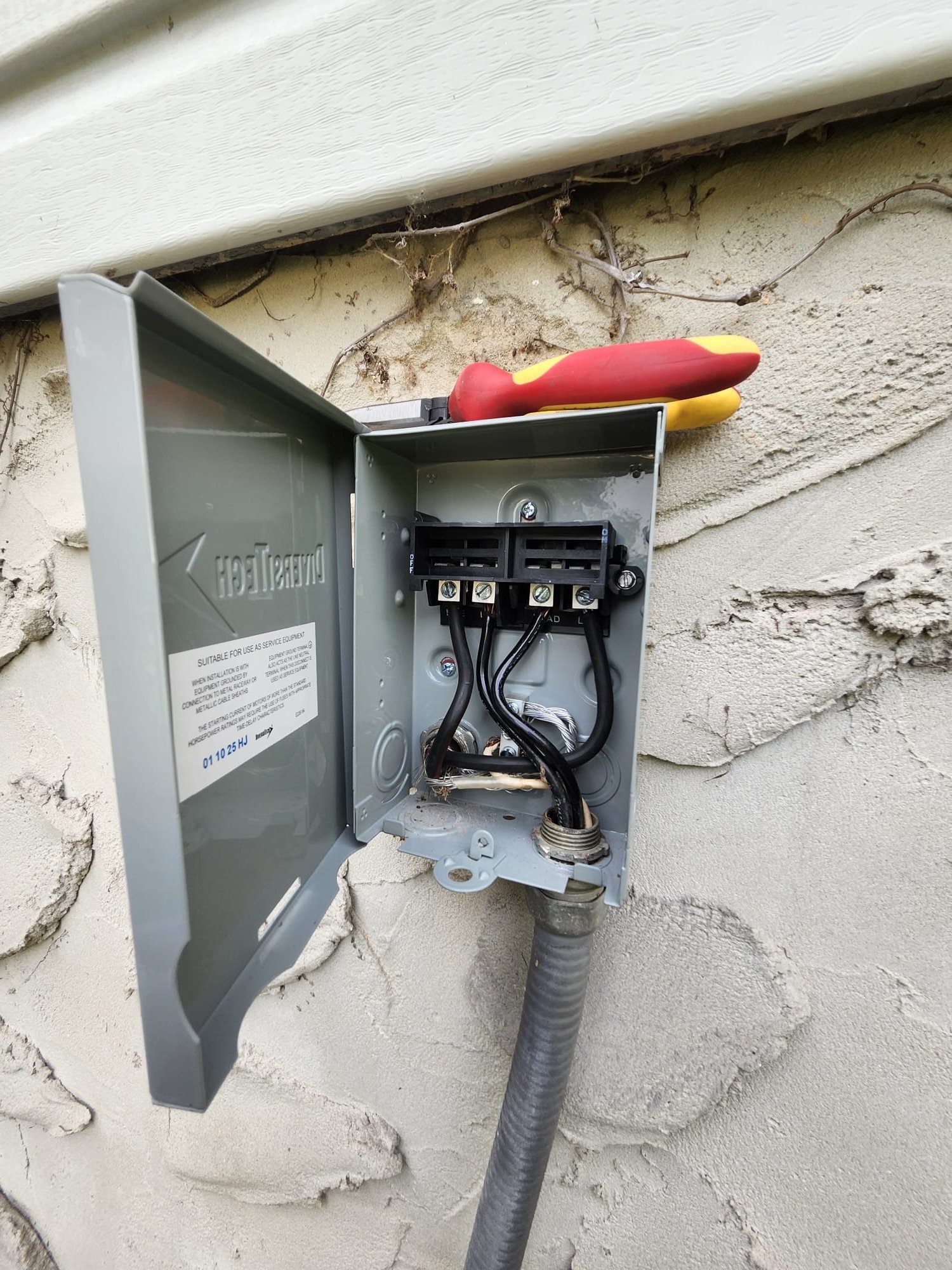 Newly installed outdoor HVAC disconnect box