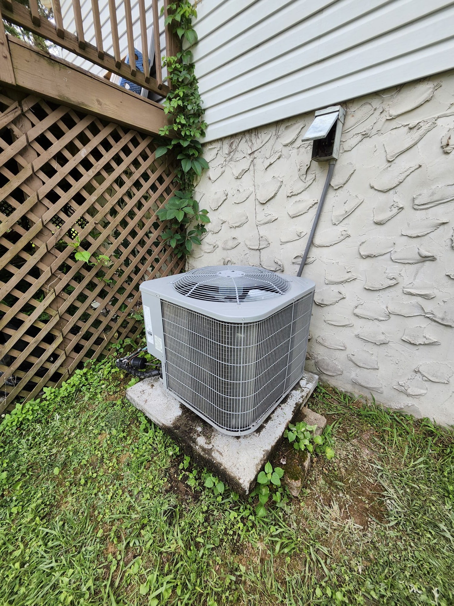 Outdoor condenser with service access visible