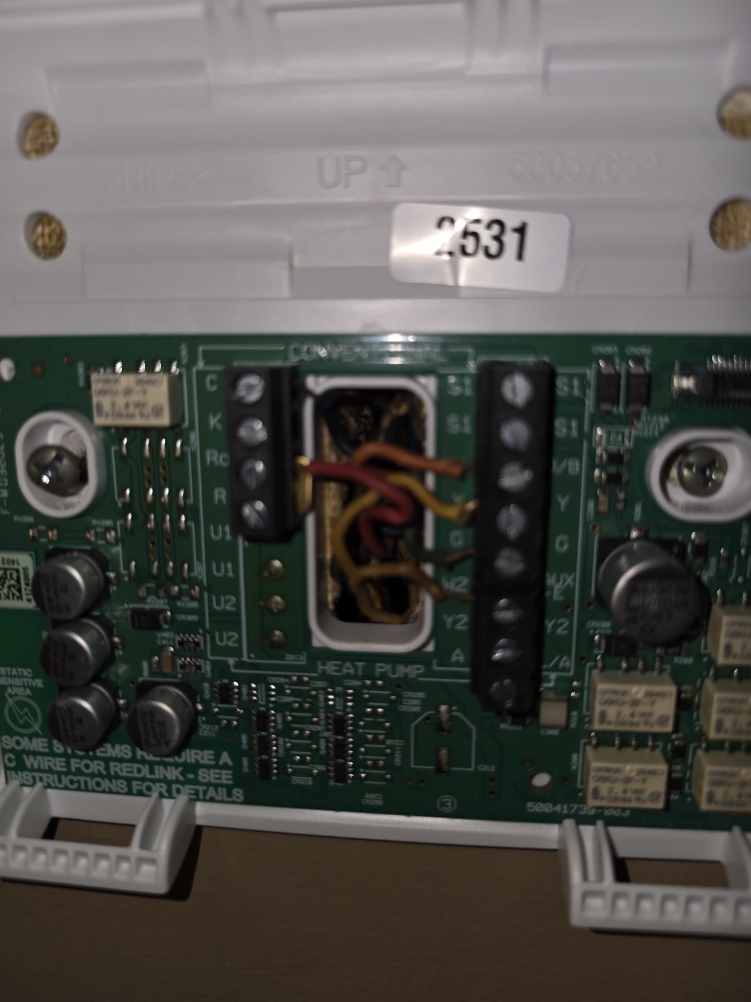 Thermostat wiring exposed during HVAC inspection