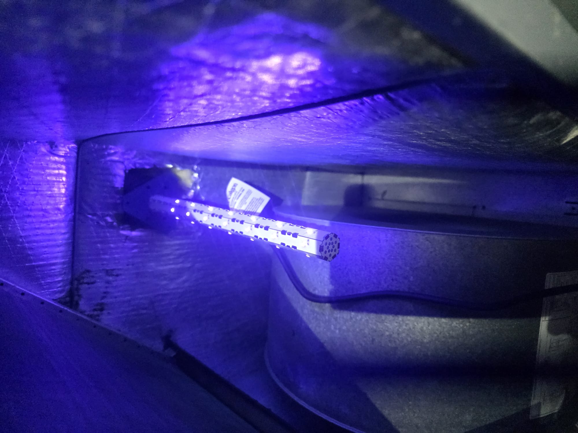 Newly installed UV air treatment light operating inside the HVAC system