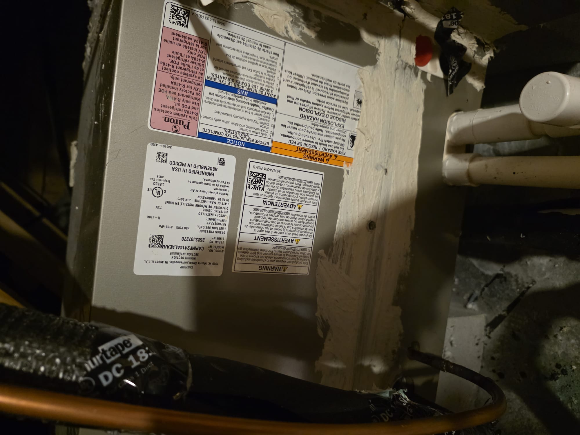 Indoor HVAC coil and refrigerant lines in an attic space