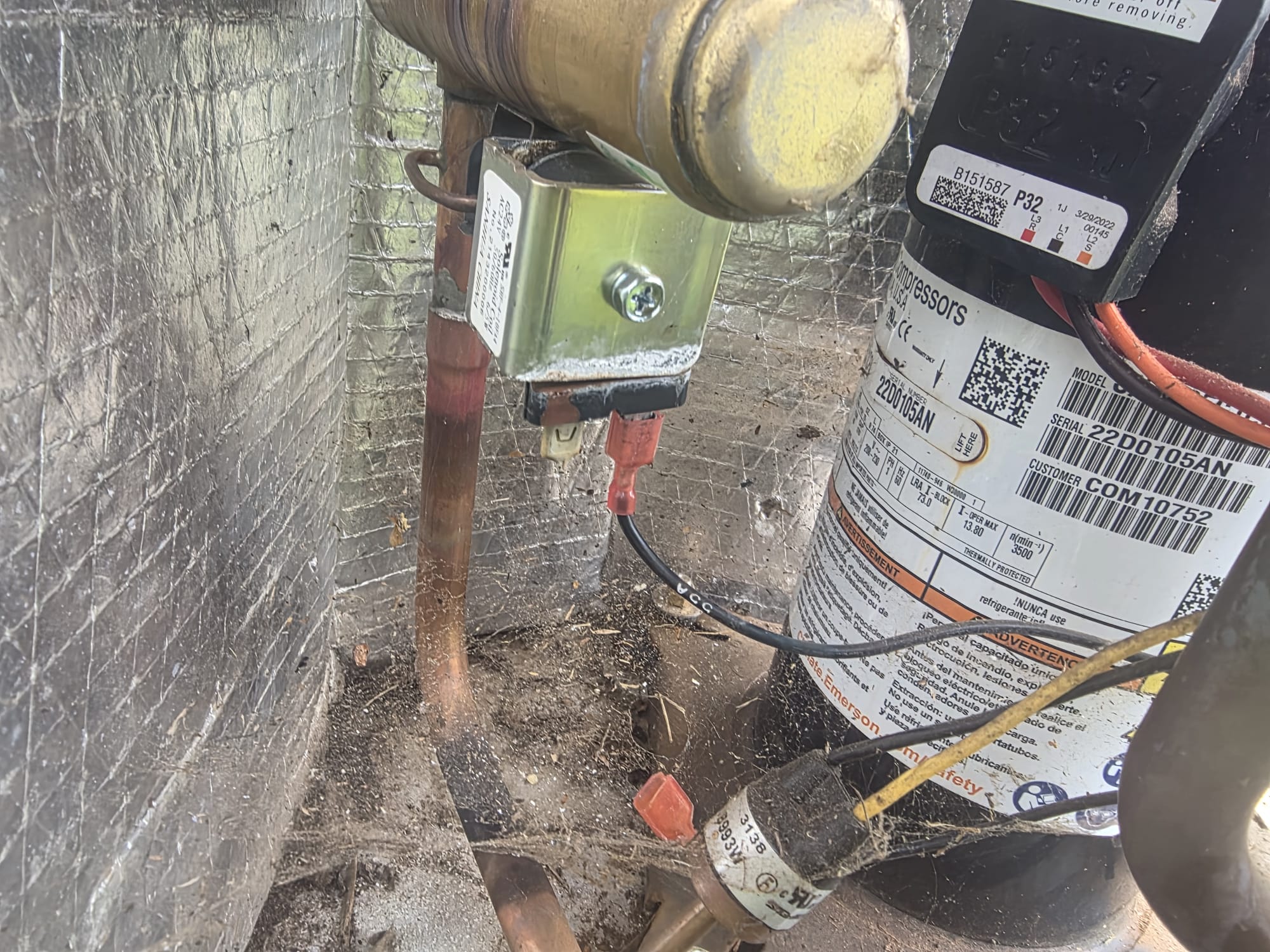 Inside HVAC outdoor unit during service